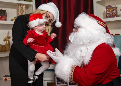 Santa, Mom and Tot getting their introductions down